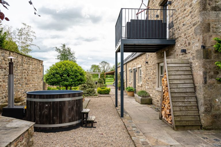 cottage with a hot tub