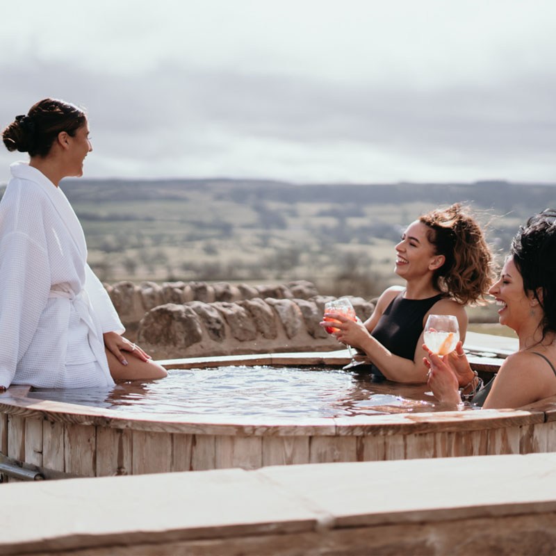 3 Women Laughing in a hot tub