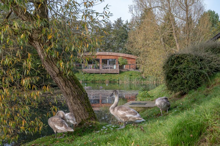 Exterior of Jasper Lodge with wildlife and scenic lake views at Brompton Lakes, Yorkshire.