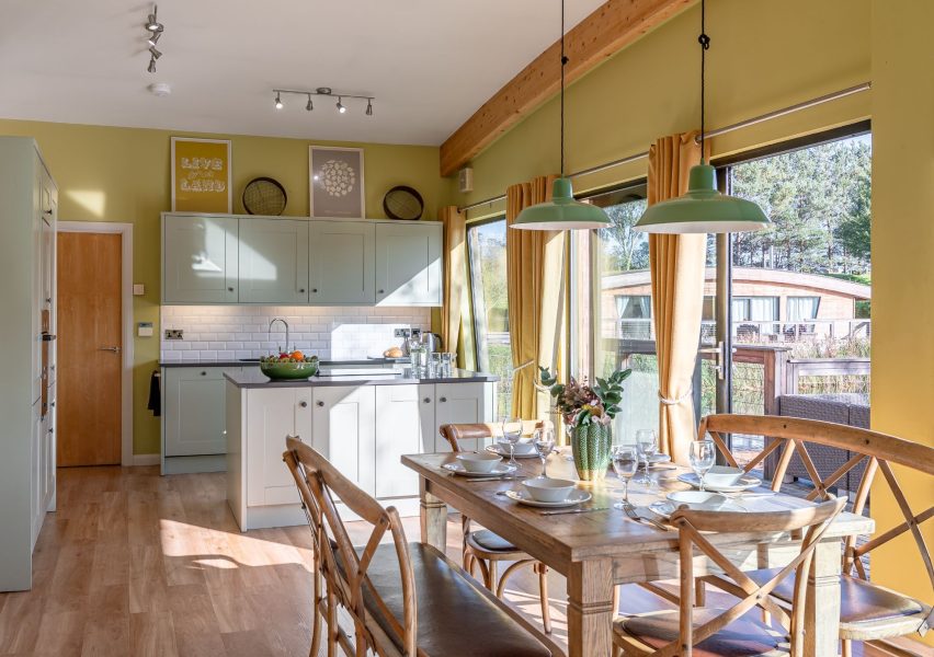 Bright, open-plan kitchen and dining area in Florence lodge at Brompton Lakes.