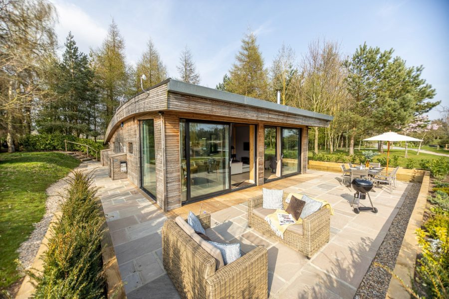 Exterior of Jules lodge with private patio at Brompton Lakes.