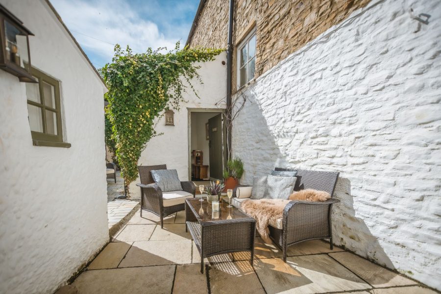 Porte House outdoor courtyard with seating area.