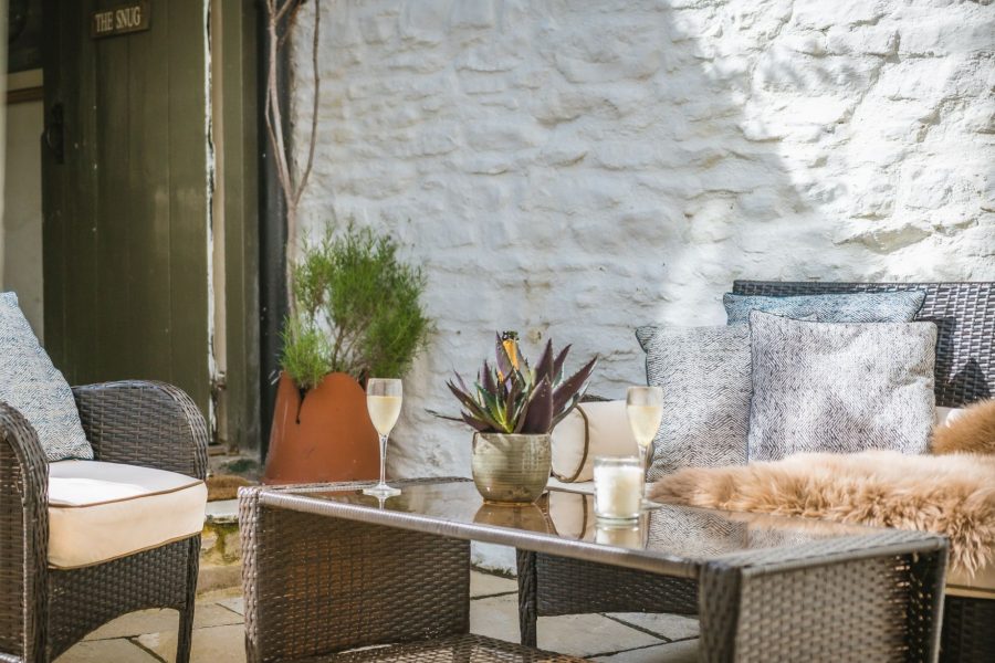 Porte House outdoor courtyard with seating area.