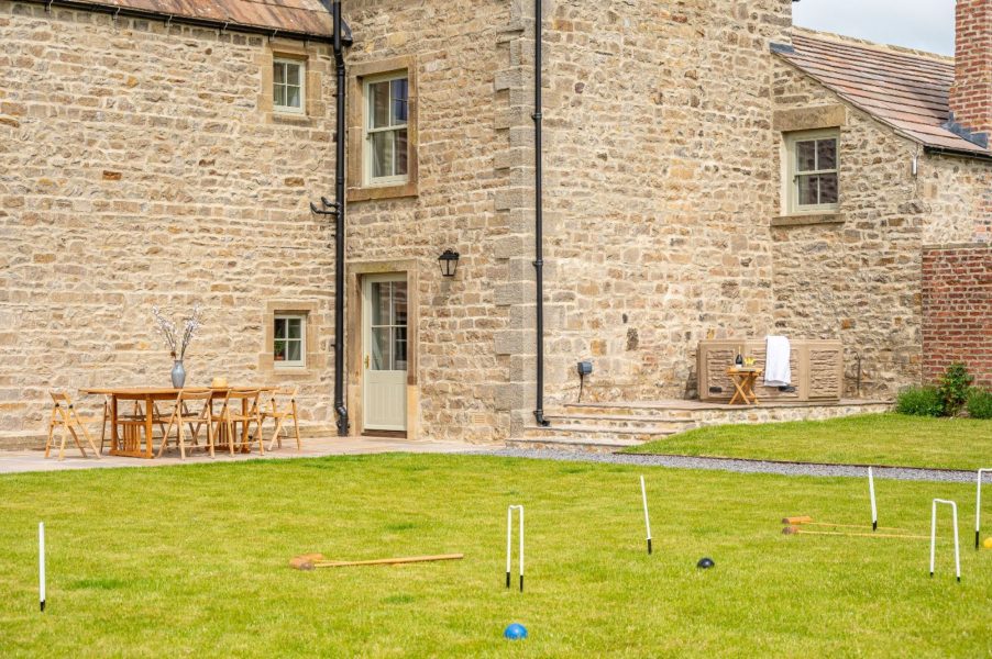 Garden with croquet game at Hollins Farmhouse in North Yorkshire.