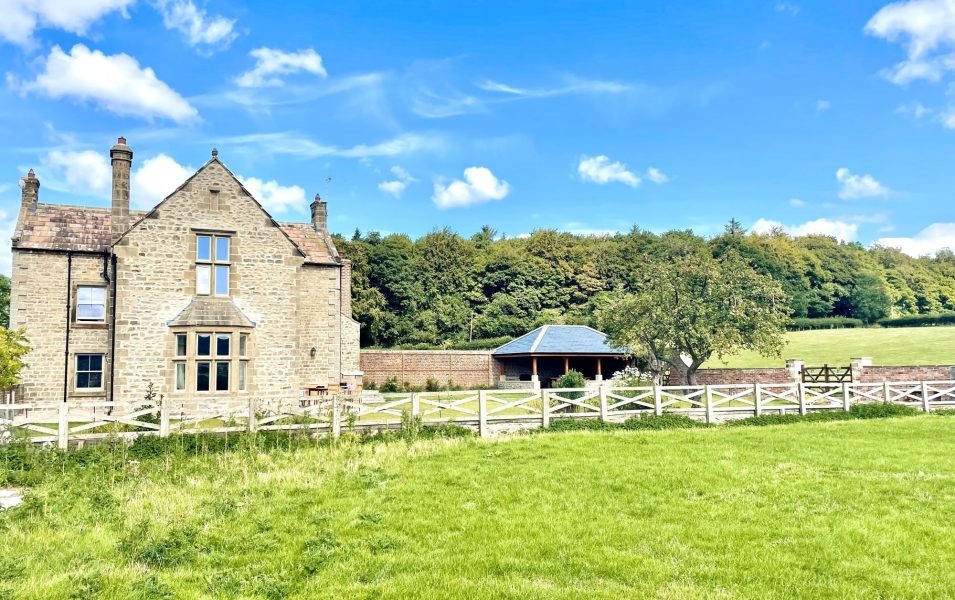 Exterior of Hollins Farmhouse, a large holiday home with large private garden in North Yorkshire.