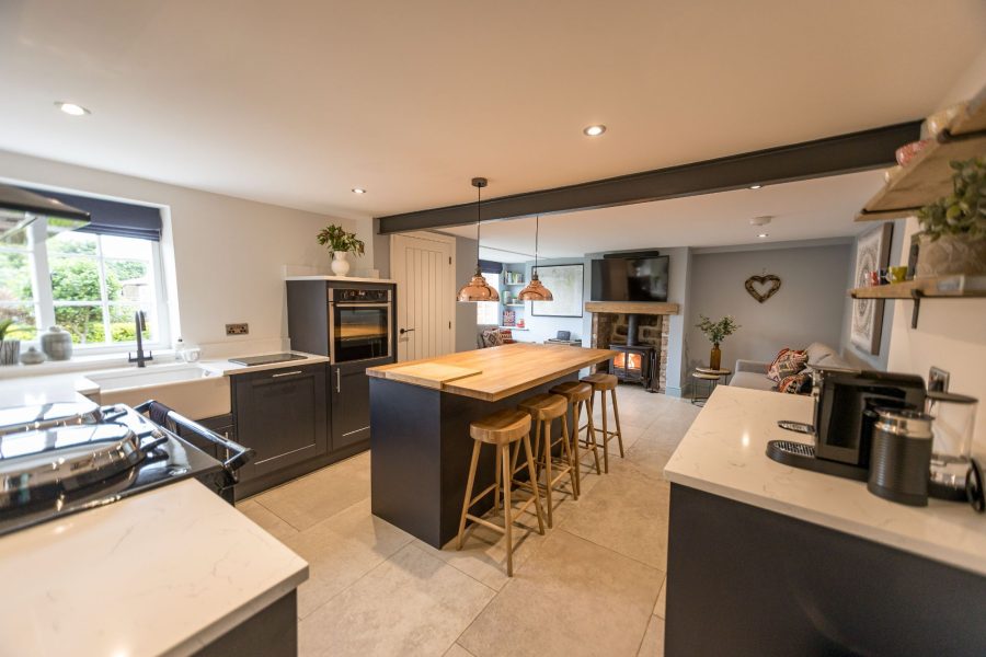 Open-plan kitchen at Paddock View with central island, range cooker and modern fittings.