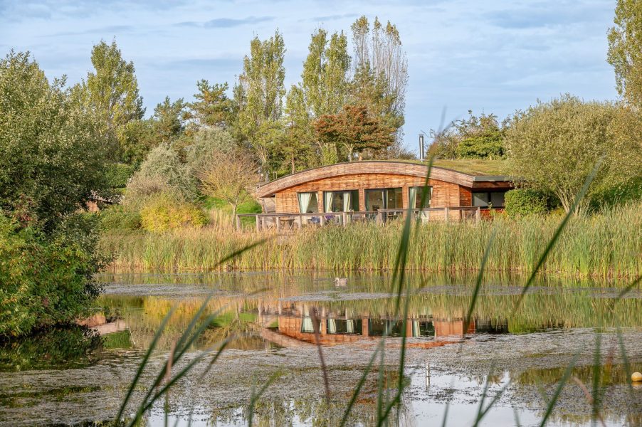 Exterior of Coco lodge at Brompton Lakes with lakeside views in North Yorkshire.
