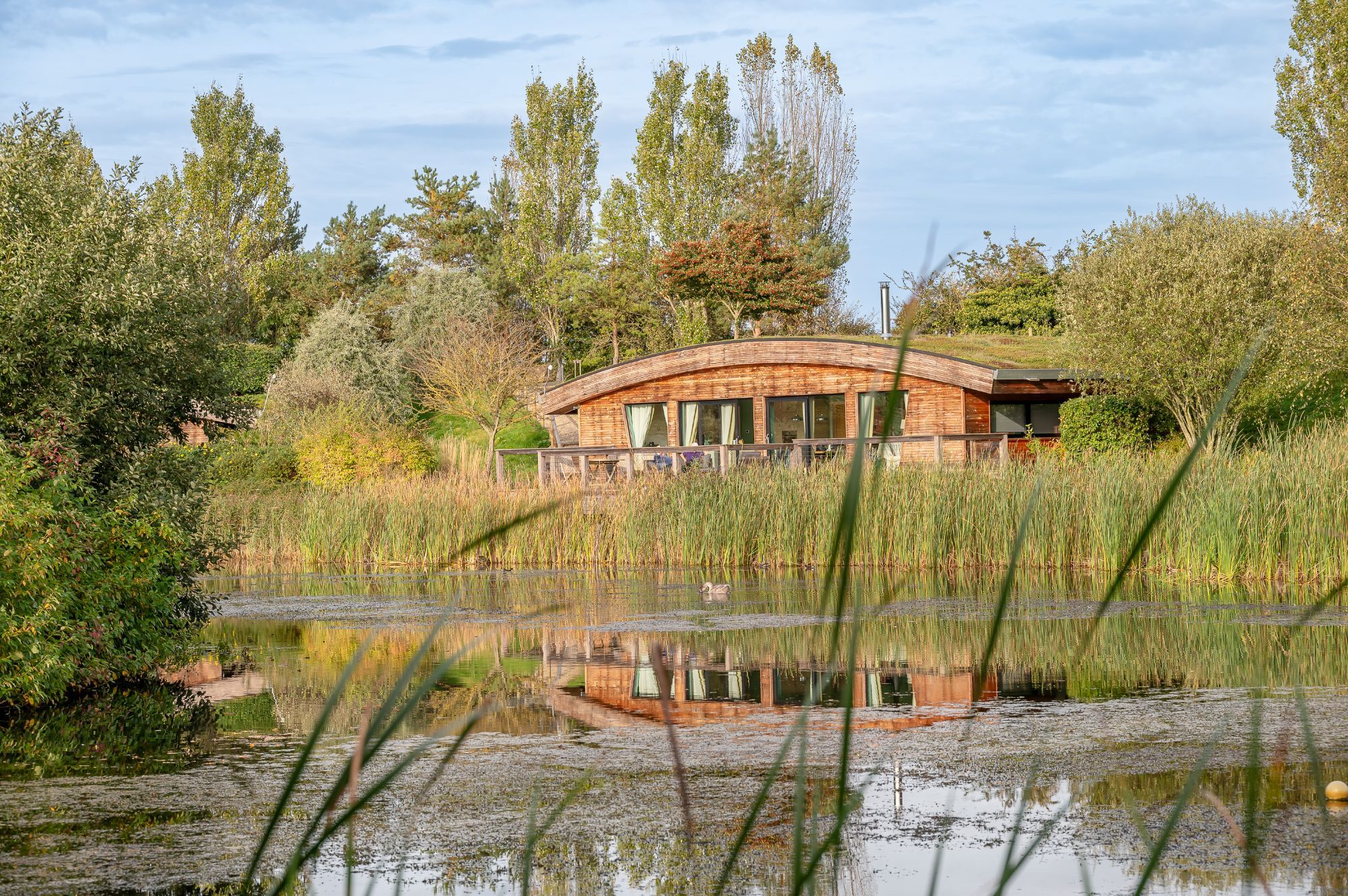 Exterior of Coco lodge at Brompton Lakes with lakeside views in North Yorkshire.