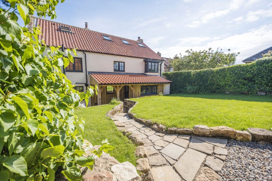 Exterior view of garden at Paddock View in Osmotherley showing path and enclosed garden.