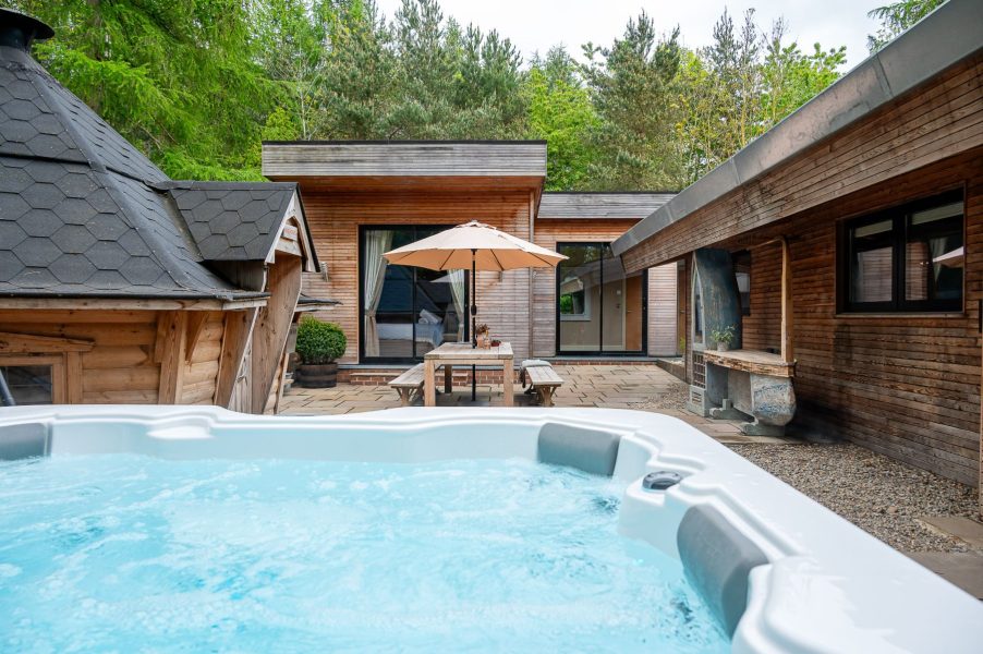 Private hot tub in the enclosed area of Twenty One lodge at Brompton Lakes, North Yorkshire.