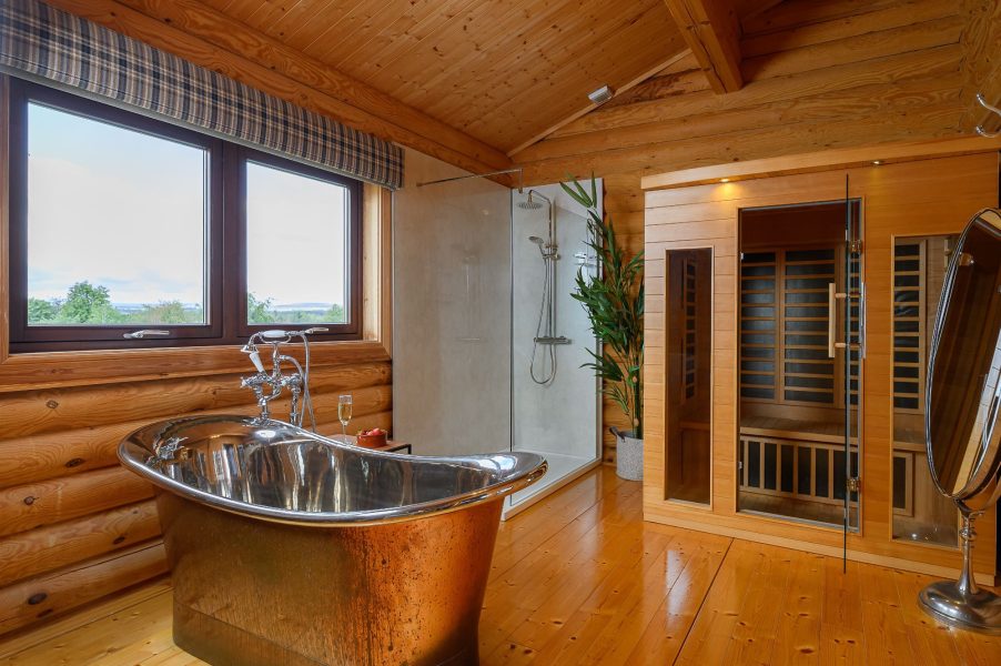 Luxury bathroom in Rosina lodge with freestanding copper bath, walk-in shower and sauna.