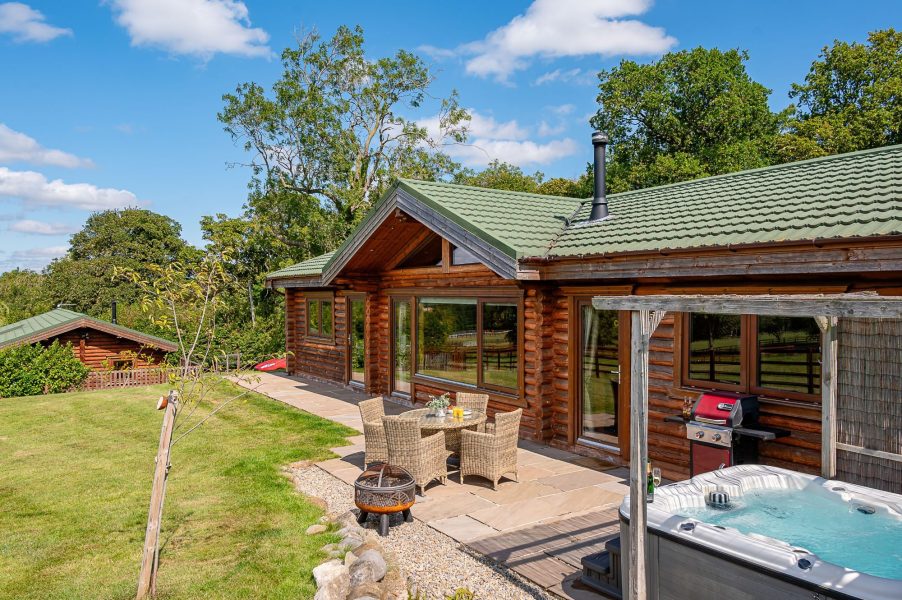 Exterior of  Constable Burton with private patio, hot tub, garden lawn and countryside views.