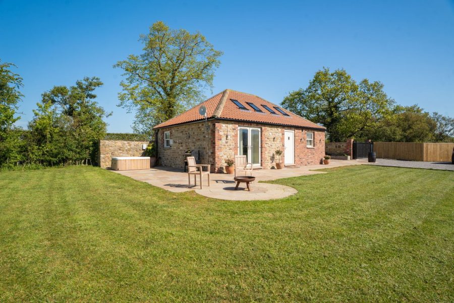 Exterior of Whitwell Nook, hot tub and outdoor furniture 