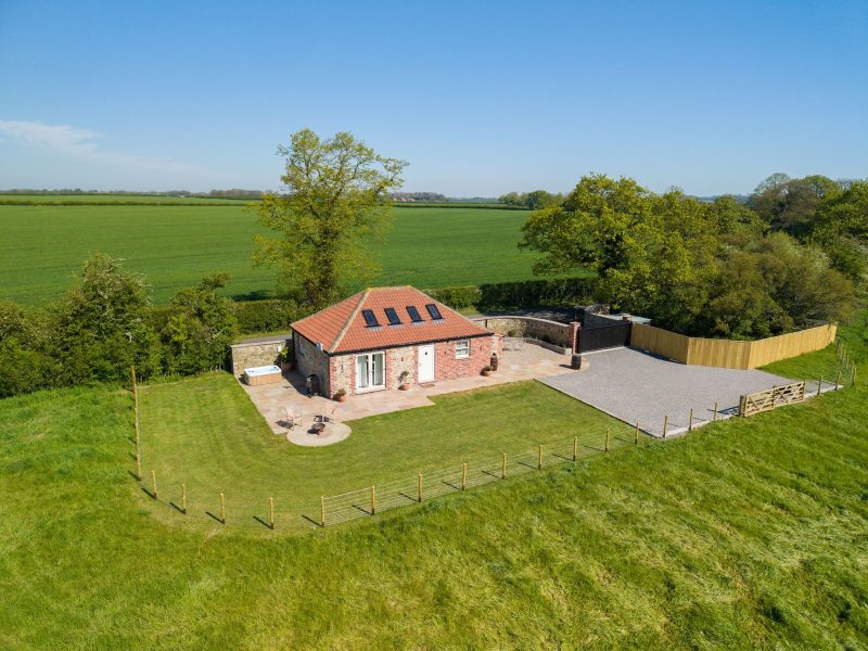 Exterior of Whitwell Nook, hot tub and outdoor furniture 
