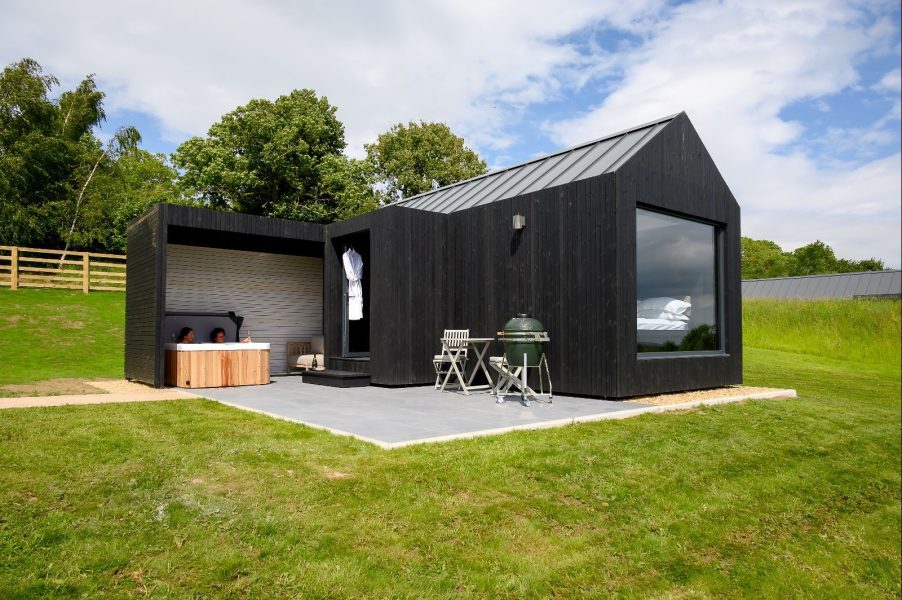 Contemporary black lodge exterior set within peaceful Yorkshire countryside