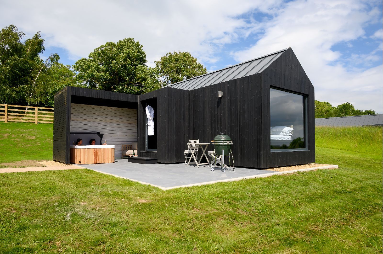 Contemporary black lodge exterior set within peaceful Yorkshire countryside
