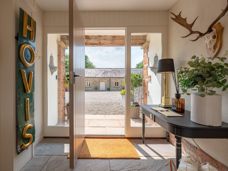 Welcoming entrance hallway with courtyard view at Feathered Nest holiday cottage