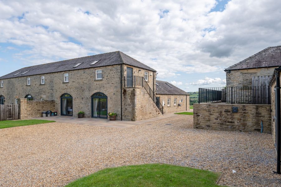 Shorthorn barn exterior with traditional stonework, private courtyard and countryside setting