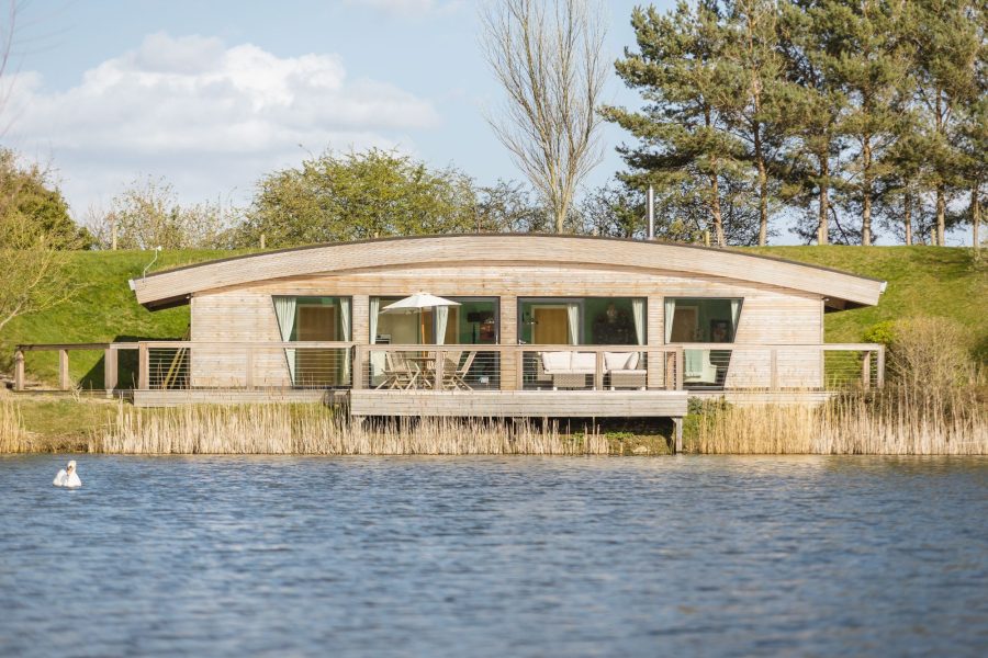 Exterior of Coco lodge at Brompton Lakes with lakeside views in North Yorkshire.