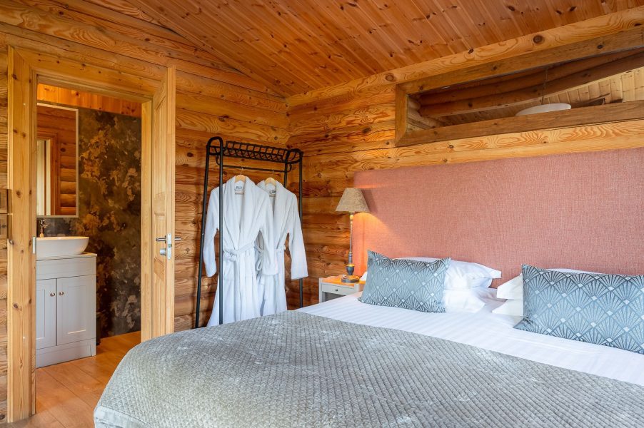 Bedroom in William lodge with double bed and ensuite access.