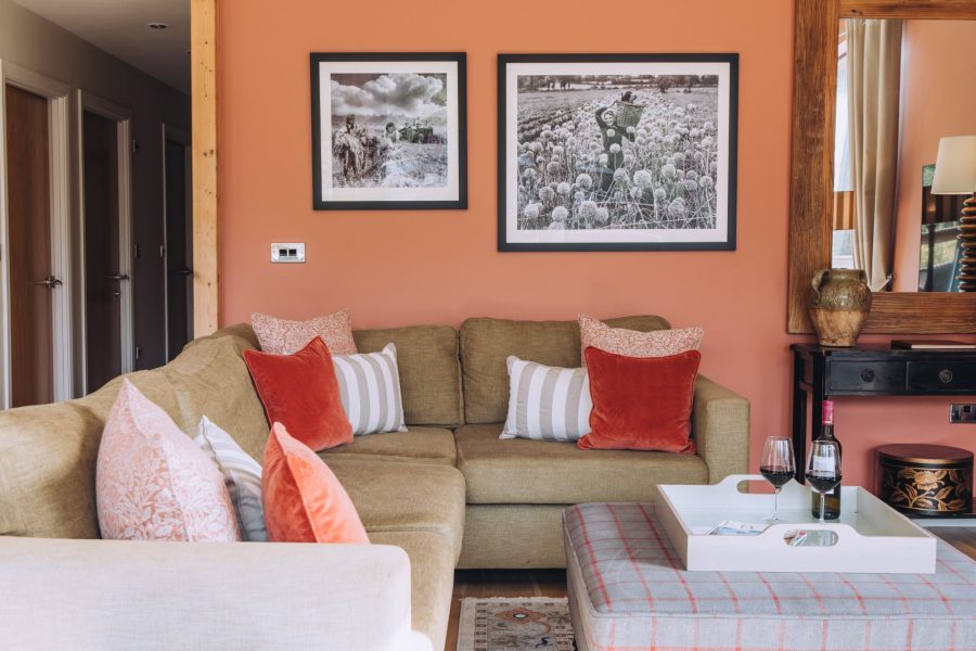 Comfortable lounge at Cara lodge with cosy seating, wood burning stove at Brompton Lakes, Yorkshire.