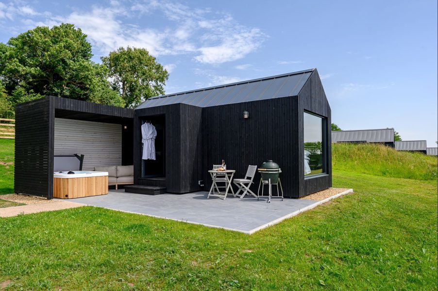 Contemporary black lodge exterior set within peaceful Yorkshire countryside