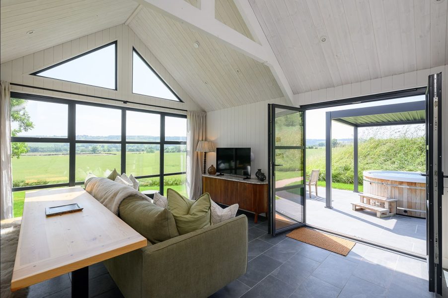 Luxury lodge interior in Ake in North Yorkshire with countryside views, vaulted ceilings and private hot tub terrace.