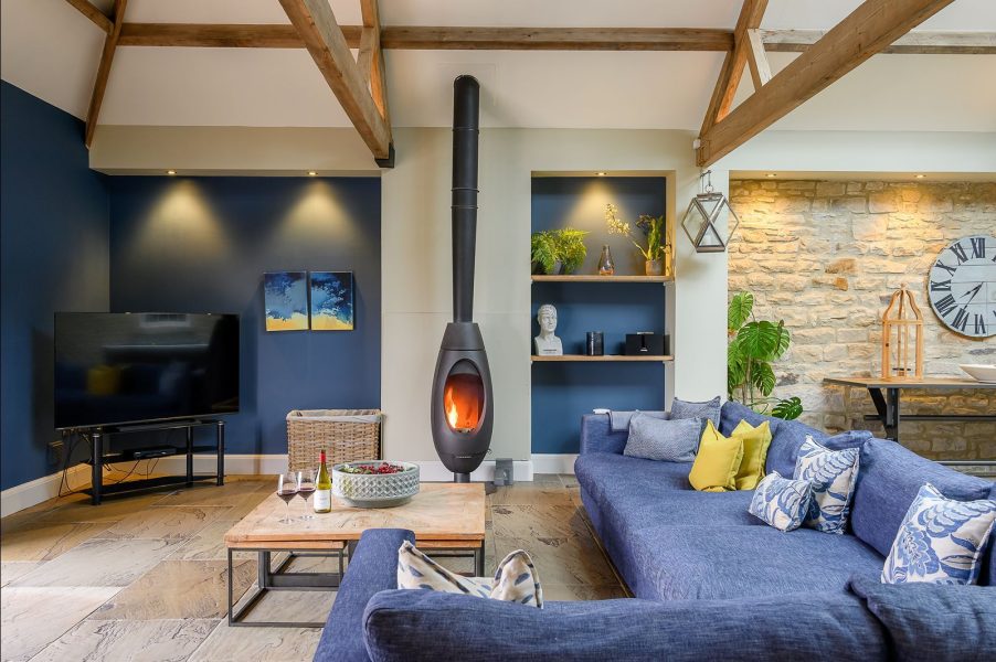 Luxury open-plan living room with log burner in Dexter, a luxury holiday home in Yorkshire.