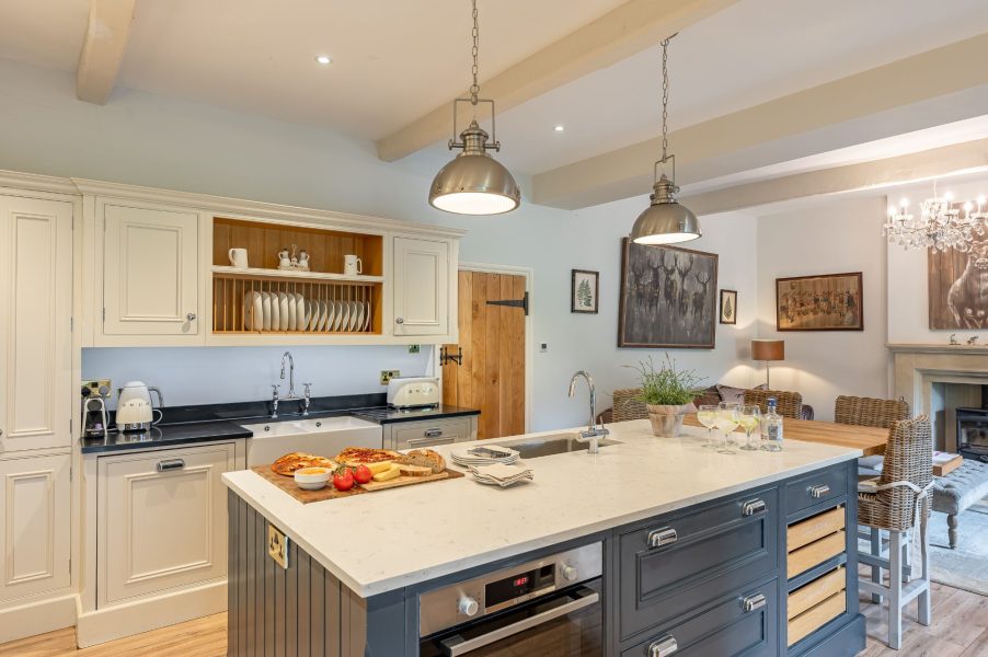 Modern kitchen and large island and appliances in Sun Hill Farmhouse.