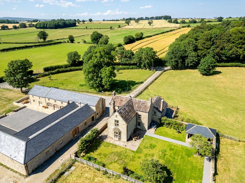 Aerial view of Hollins Farmhouse and Hollins Barn